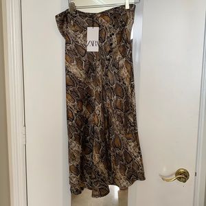 Sexy , trendy , feels like silk , snakeskin print skirt,  button detail, slit